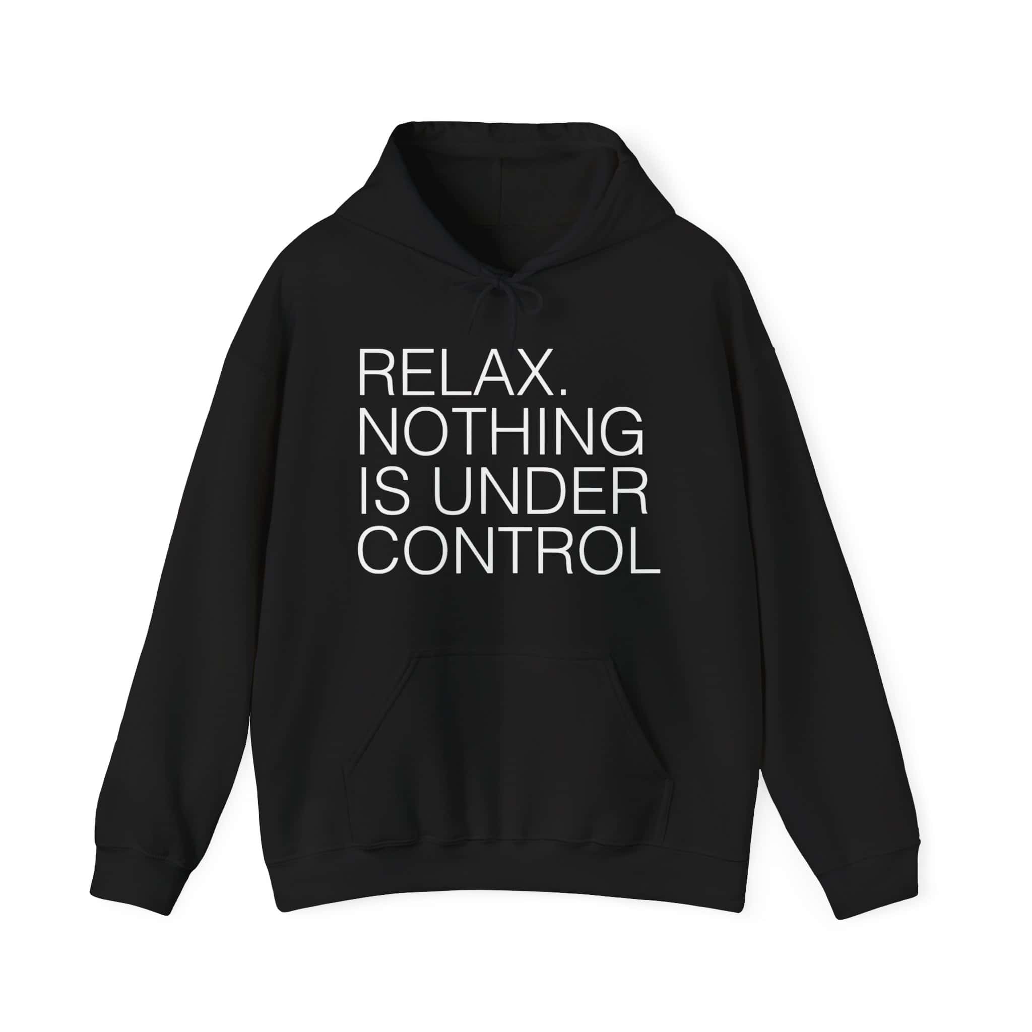 Relaxed black hoodie with bold white text saying "RELAX. NOTHING IS UNDER CONTROL" for a cool and affordable statement fashion piece.