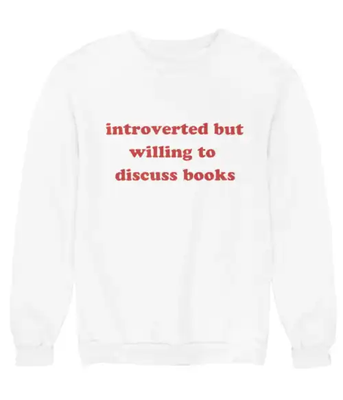 Cozy white sweatshirt with red text that says "introverted but willing to discuss books", perfect for casual wear and expressing love for reading on a budget.