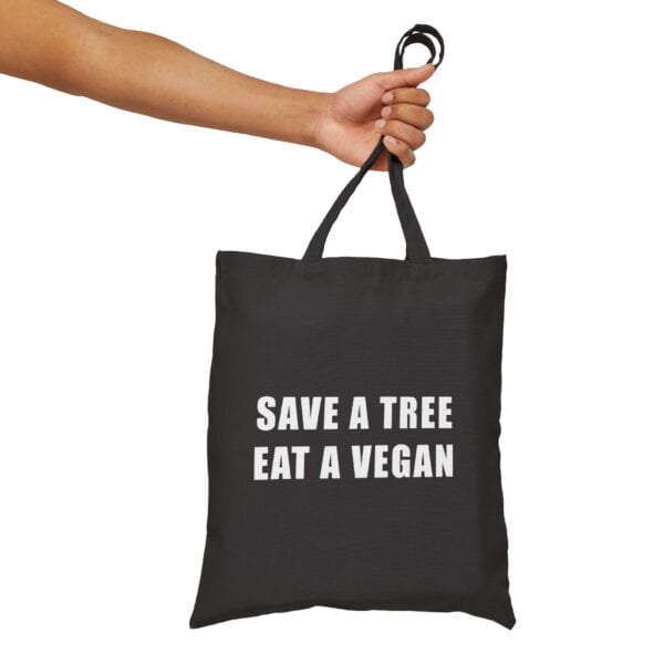 Save the environment tote bag promoting veganism and saving trees,eco-friendly reusable black fabric bag, ideal for casual and statement clothing accessories, with bold white text.