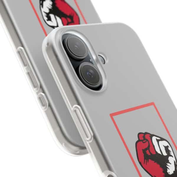 2. Close-up of a smartphone with a stylish graffiti sticker, dual camera, and sleek silver case.