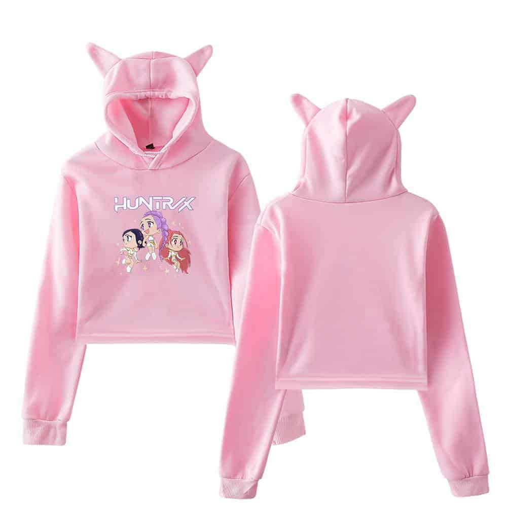Hoodie with cute cat ears and anime characters print, in pastel pink, perfect for casual wear.